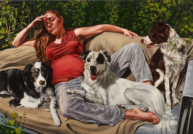 Portrait of woman and dogs on couch