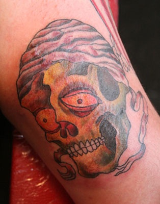 Skull on inside arm.