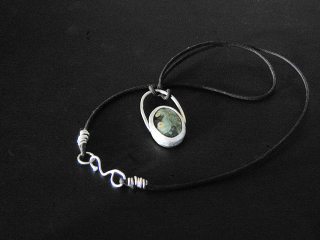 Ocean Jasper and silver on a black cord with a silver wrapped wire clasp