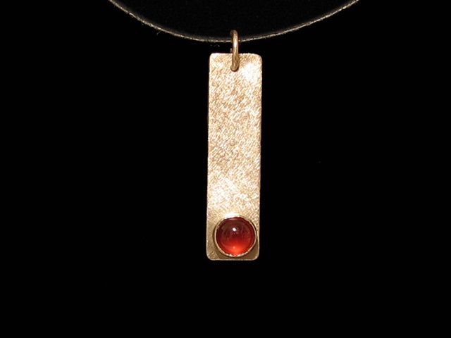 Almandine garnet and silver on leather cord