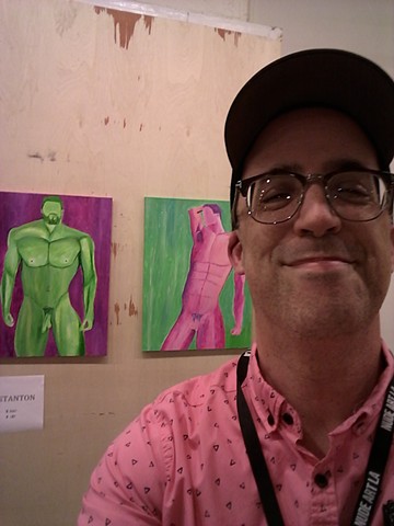 Artist Christopher Stanton with his acrylic nude paintings