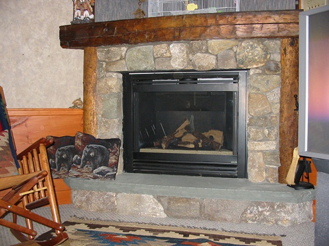 Stone faced gas fireplace
