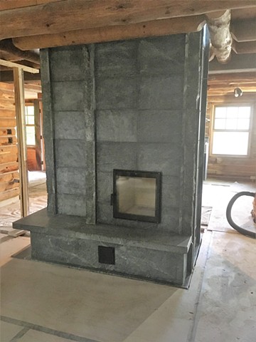 Custom soapstone masonry heater by Greenstone