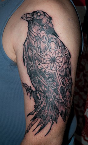 abstract raven tattoo and compass by chris lowe of naked art tattoo