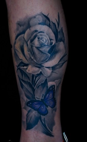 realistic black and grey rose tattoo by chris lowe of naked art tattoos in maryland .