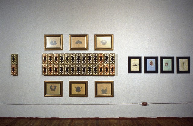 Jennifer McMackon, Rorschach Test Wall, arrangement of paintings and objects on a wall, detail, 1992