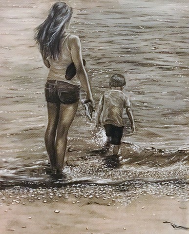mother and son walking in water 