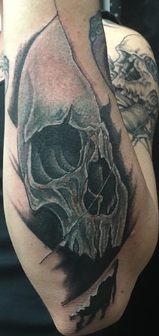 Cover up of tribal with Skull