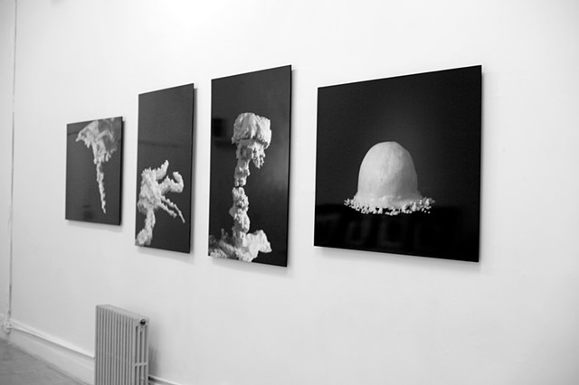 installation view of frosting photos of recreated atomic bomb explosions