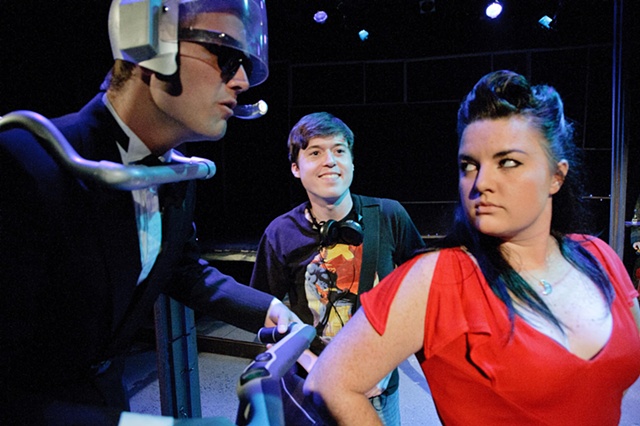 The characters inside Kyle's play, Spacebar, come to life for the first time as he looks on.