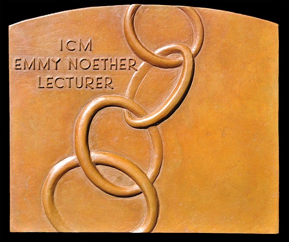 Reverse of the Emmy Noether Lecturer Plaquette.  The image is of Notherian rings.