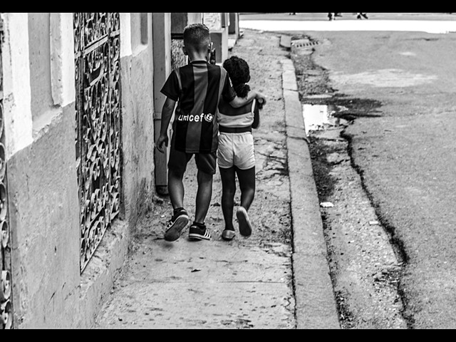 Children walking in Old Havana, Cuba. 