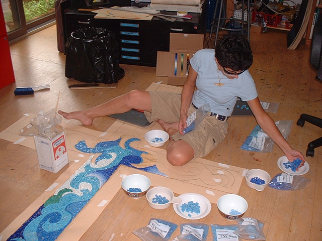 The selection of the glass mosaics become more complex as the work progresses.