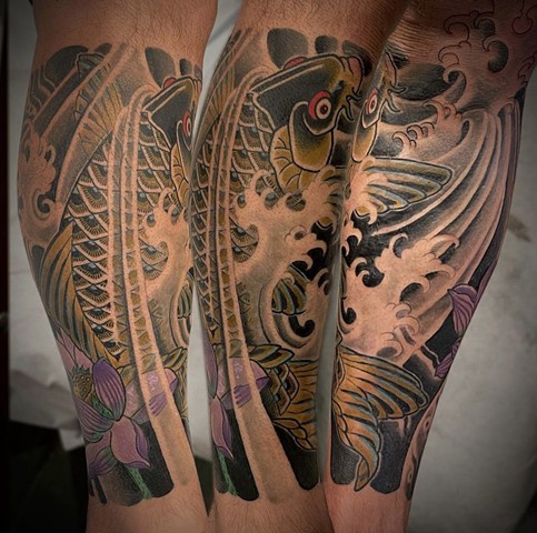 A traditional Japanese lower leg sleeve featuring a black koi in water