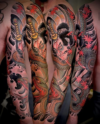 A traditional Japanese full sleeve, featuring a Namakubi, snake and red maple leaves
