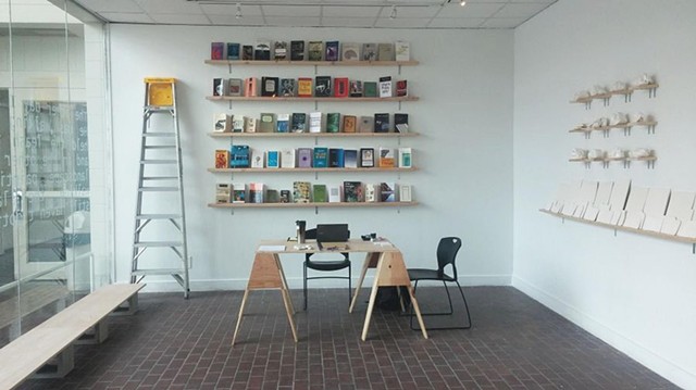 Zone 1 / Conceptualization/Research: Book wall [Resonant source material organized via contiguous association], Service Desk [Open ended station – for reading, contemplation and conversation], Guest Seating, Modular Object Placement