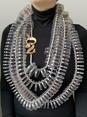 13 foot long necklace comprised of found coins & cotton twine