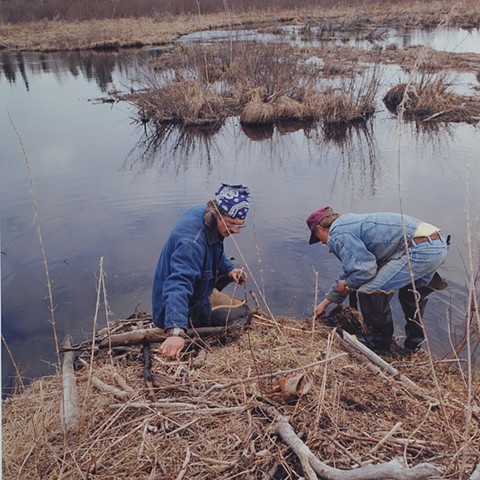 Nick and Ed checking a trap, Lost Creek, near Cusson, Minnesota 1996