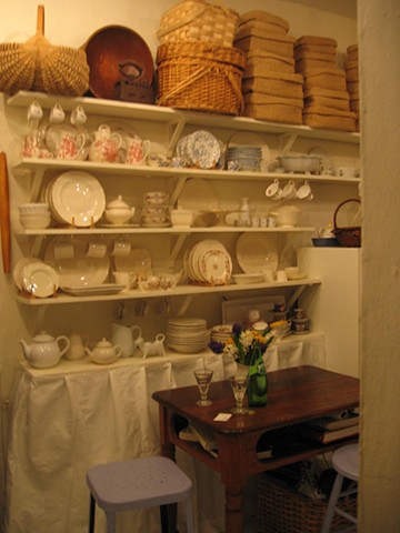 Open shelving is a cost effective solution for storing pretty dishes by Jane Interiors NYC
