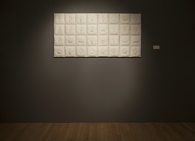 mixed media wall installation comprised of painted ceramic on linen with stitching by Mary Meyer