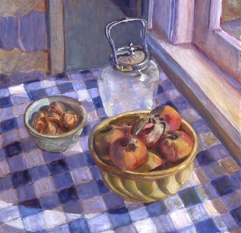 Peaches and walnuts on blue checkered cloth