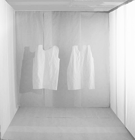installation of exam room made of paper with floating hospital gowns