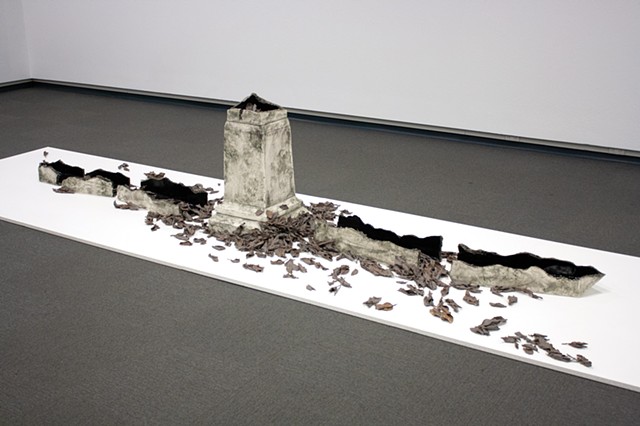 Monument base with fractured and toppled obelisk, with deep black interior glaze. Surrounded by a windfall of blighted apple leaves, dipped in porcelain and burned away. 