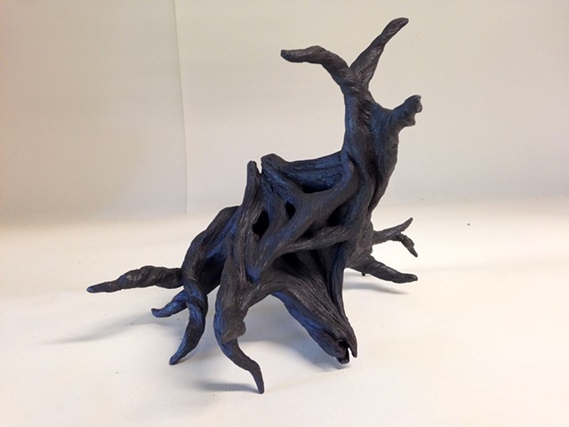 Black stoneware neuron, before adding lights, wires and air dry clay.