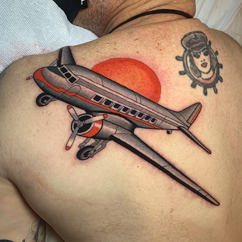 passenger plane tattoo by tattoo artist dave wah at stay humble tattoo company in baltimore maryland the best tattoo shop in baltimore maryland