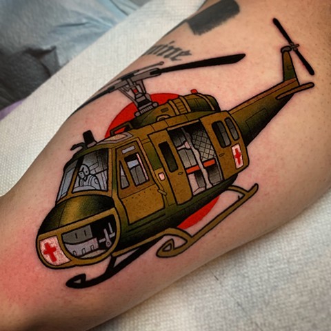 huey helicopter tattoo by tattoo artist dave wah at stay humble tattoo company in baltimore maryland the best tattoo shop in baltimore maryland