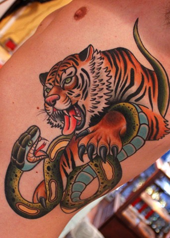 tiger and snake tattoo by dave wah at stay humble tattoo company in baltimore maryland the best tattoo shop in baltimore maryland