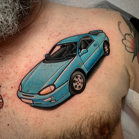 mazda tattoo by tattoo artist dave wah at stay humble tattoo company in baltimore maryland the best tattoo shop in baltimore maryland