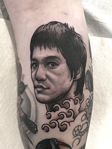 bruce lee portrait tattoo by tattoo artist dave wah at stay humble tattoo company in baltimore maryland the best tattoo shop in baltimore maryland