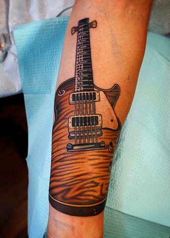guitar tattoo by dave wah at stay humble tattoo company in baltimore maryland
