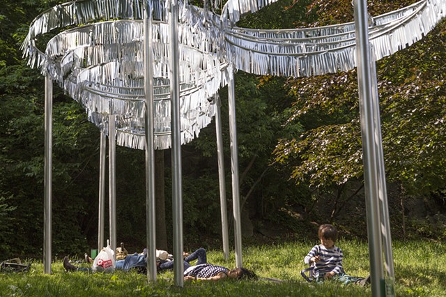 Visitors lounging under
"Reflections: Path"