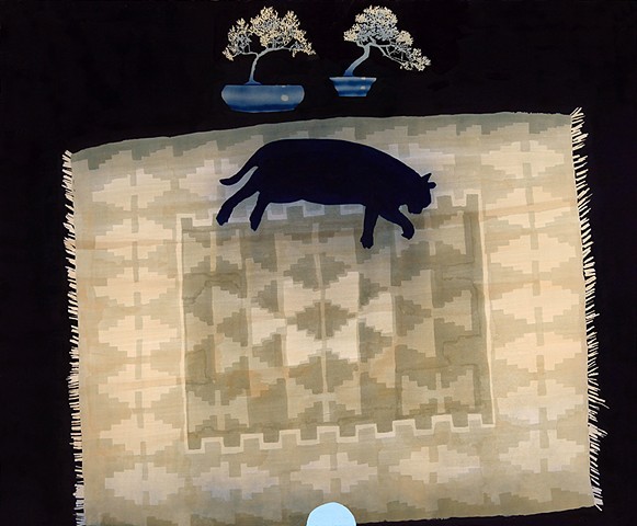 cat on rug with bonsai