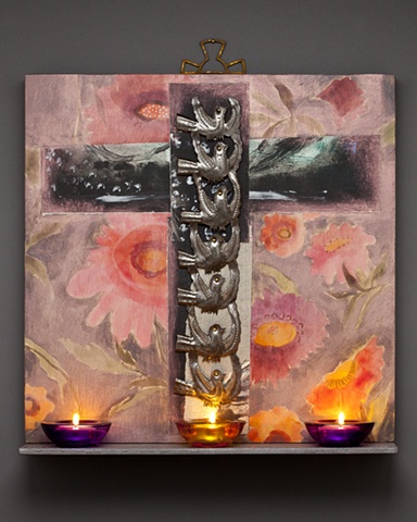 Wood panel painting with shelf holding votive candles