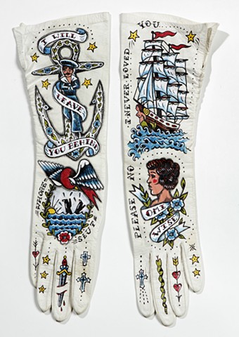 tattoo on vintage gloves with anchor, clippership, and sailor motif