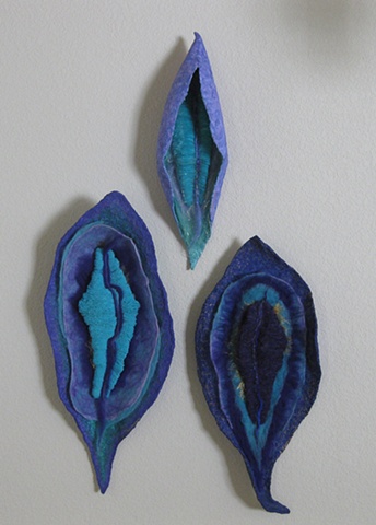 "Pods of the Elfin Sprites" is a felted mixed media piece of contemporary fiber art by Linda Thiemann.