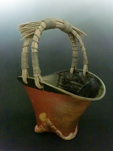 Large Wood fired Basket with Altered Foot and Rattan Handle