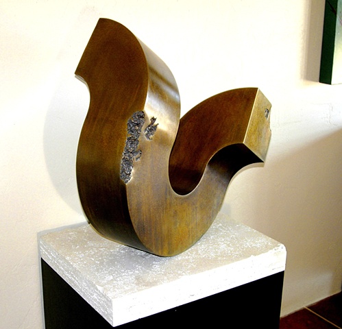 Pedestal bronze sculpture with golden patina that rocks at the slightest touch. On travertine base and steel pedestal.