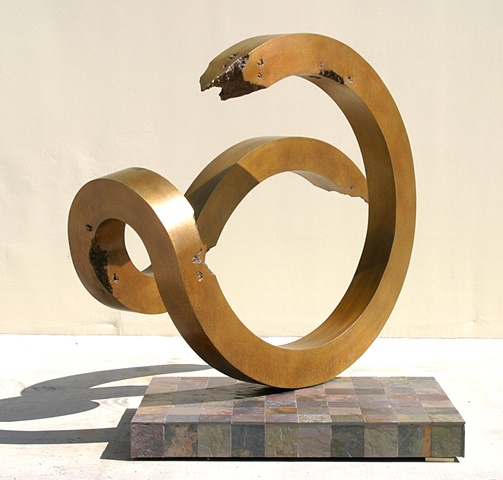 Large, outdoor bronze with golden patina.