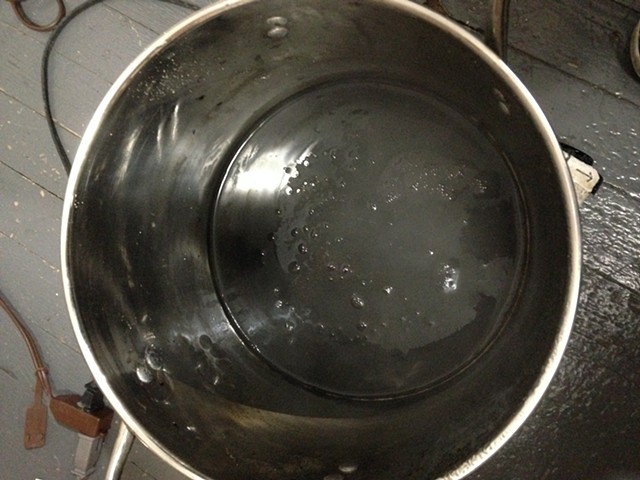The husks are strained out and the liquid is brought back to a simmer for a while longer.