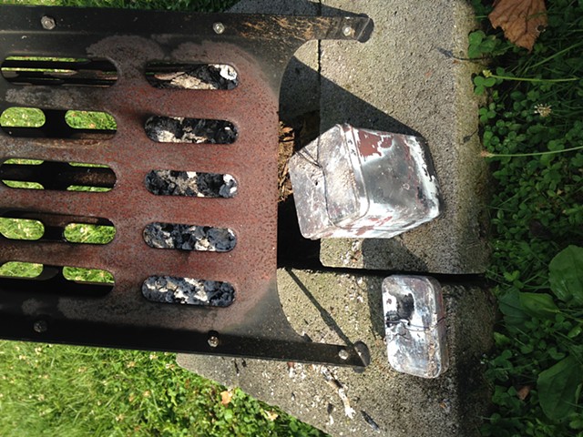 Tins of charcoal removed from the fire