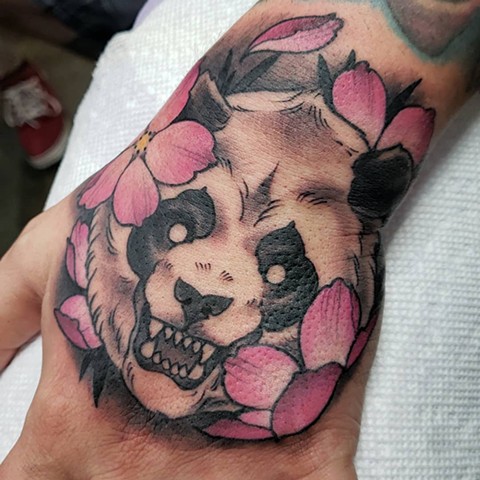 Panda bear hand tattoo