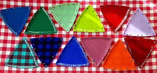 Small Triangle Plates
size:  8" sides--
top point to bottom edge approx. 7"...


