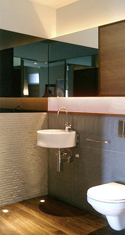 Washington Square Loft, modern minimalist bathroom, stone source, Basalt stone, grey mirror, ceramica flaminia sink, by Doug Stiles Interior Design