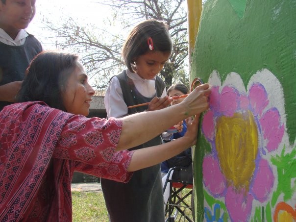 Painting murals at 'Amai Park' specially designed by Fauzia Minallah at the Almaktoom Center for the Visually Impaired in Islamabad.