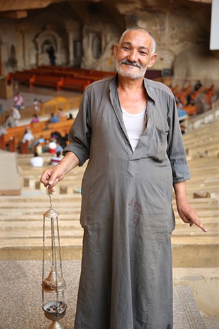 Man with incense burner in Coptic Cave Church