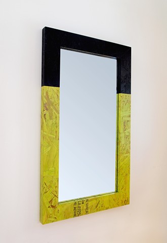 Modern OSB mirror with two tone frame in lime green and matte black. Colored and stained OSB panel frame.